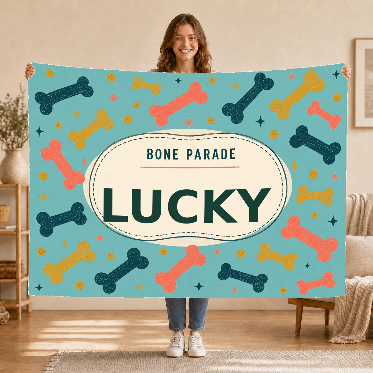 Personalised Dog Blanket – Bone Parade - Coastal Teal - Held up lifestyle