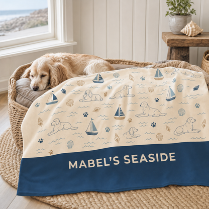 Personalised Seaside Snoozer dog blanket in a coastal dog bed