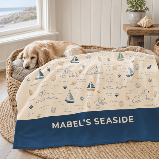 Personalised Seaside Snoozer dog blanket in a coastal dog bed